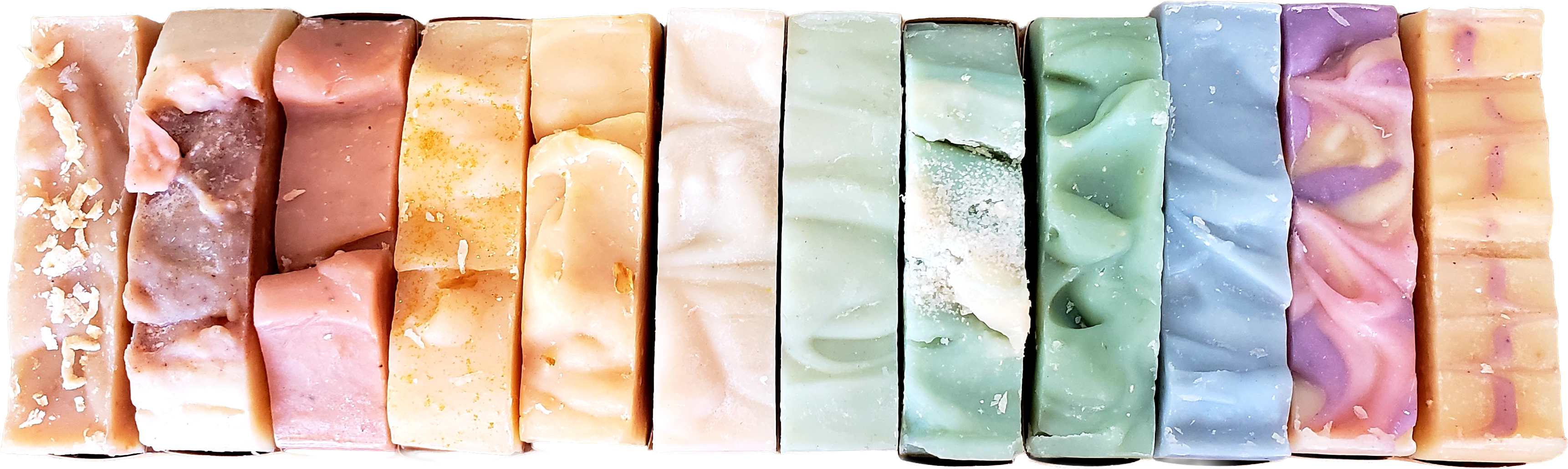 Udderlove's lineup of handmade goat milk soap bars in a row